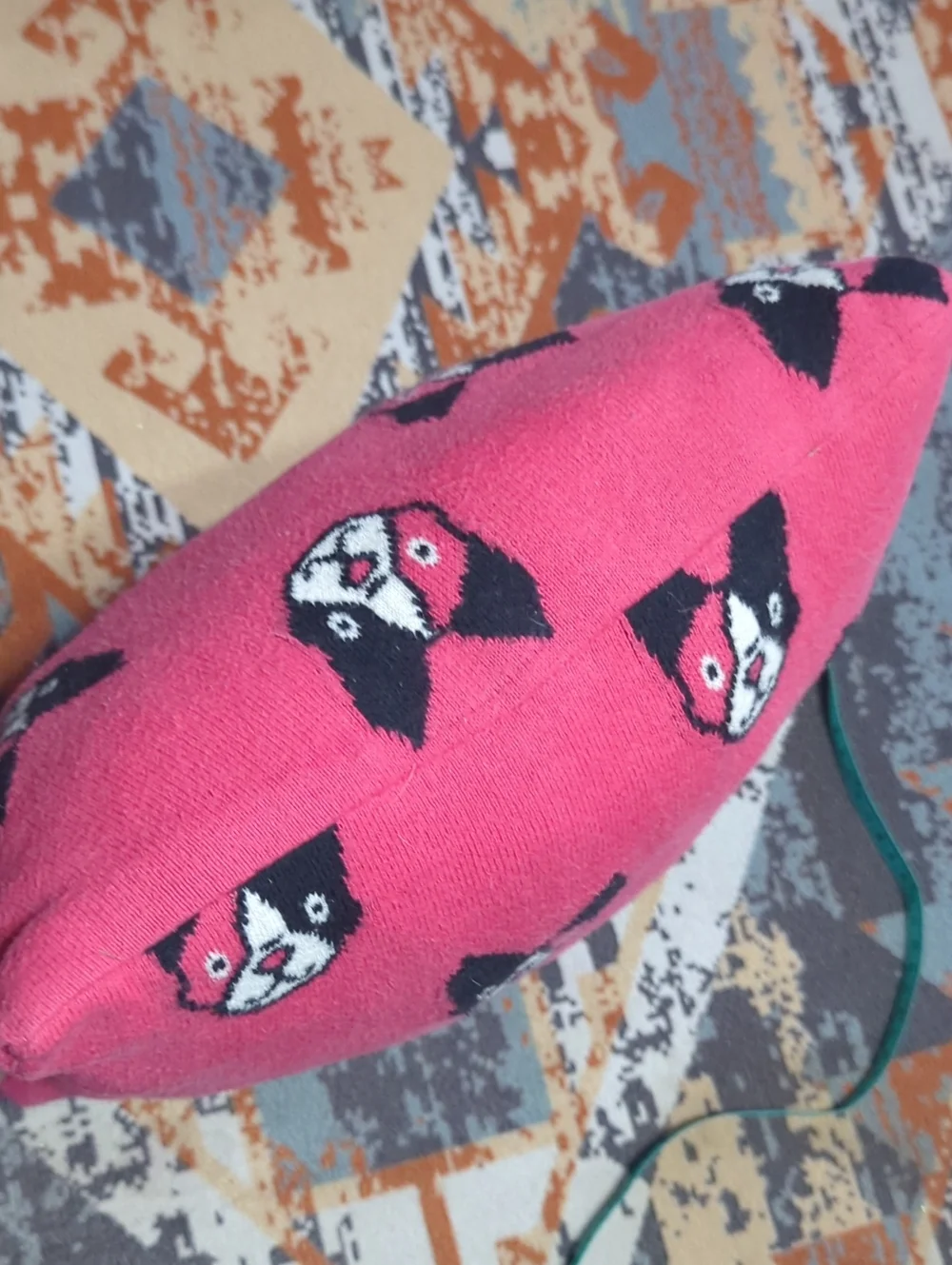 upcycled knit sweaters, featuring a gray pillow with a French bulldog Harlequin